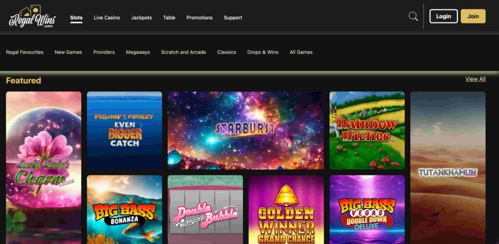 Regal Wins casino slots page showing featured games including Starburst, Big Bass Bonanza, Rainbow Riches and Lucky Lady’s Charm.